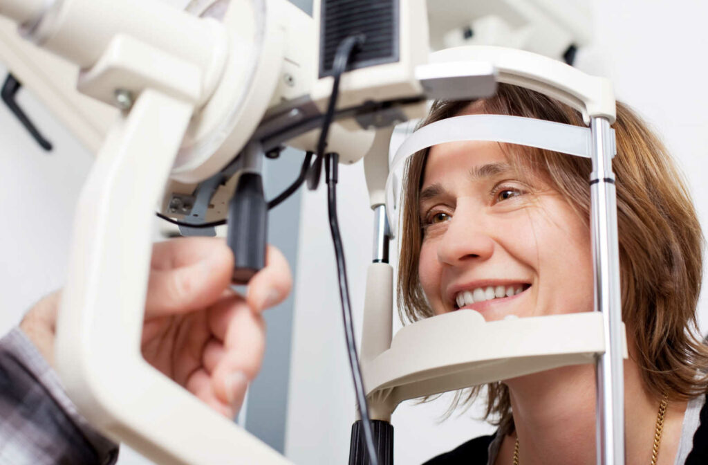 A woman with low vision getting her eyes assessed during a comprehensive eye exam so her eye doctor can determine what low vision aid is right for her